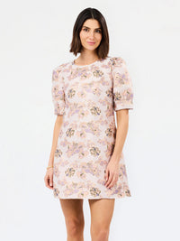 multi color pink brocade style floral dress with white background 
