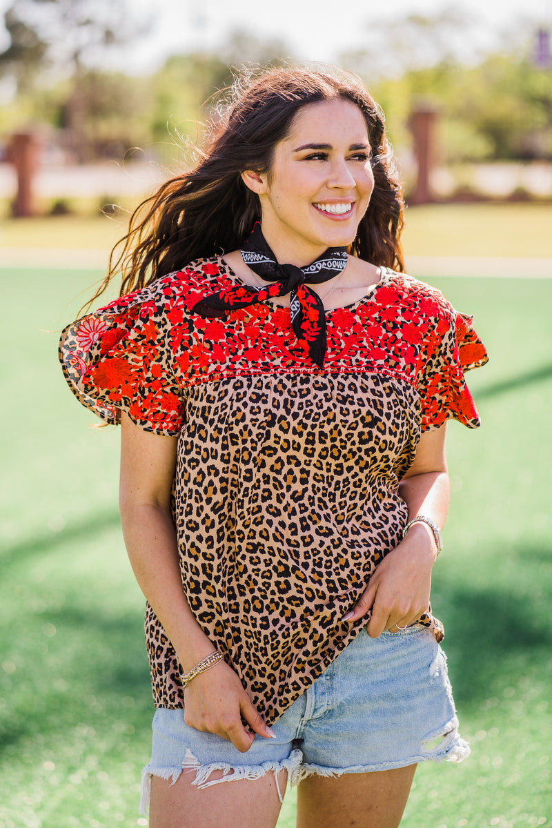 red embroidery details and print layerz clothing Lawrence top