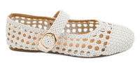 White woven flat shoe with a gold buckle on a white background corkys mixed feelings 