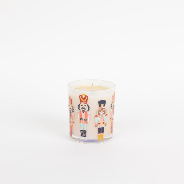 Candle with nutcracker design on a white background