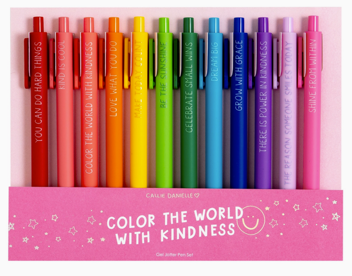 Set of colorful pens with motivational phrases in a pink box, featuring the brand 'Callie Daniele'.