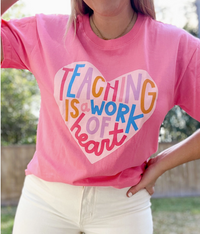 teaching is a work of heart tee on pink top 