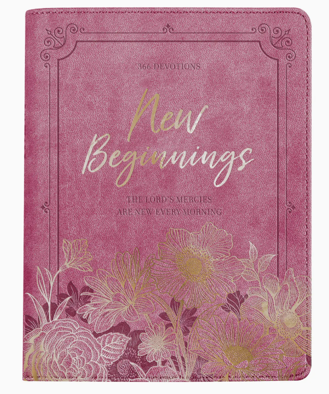 Pink devotional book titled 'New Beginnings' with floral design on a white background