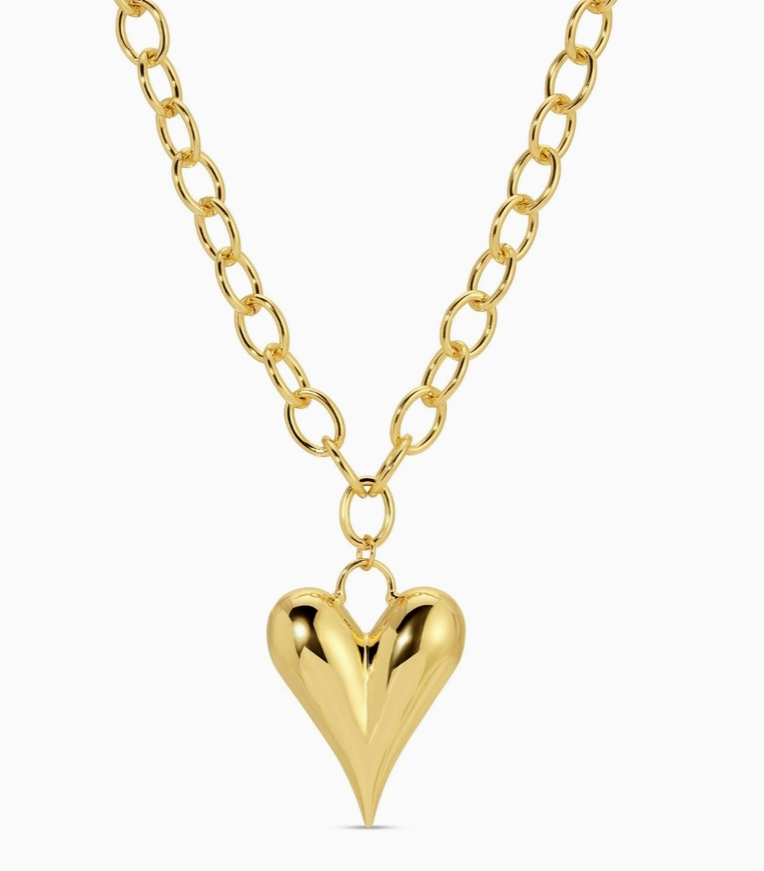 Gold heart-shaped pendant necklace on a white background