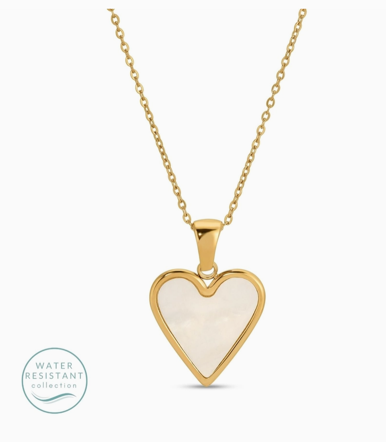 Heart-shaped pendant necklace with gold frame and white center on a white background water resistant 