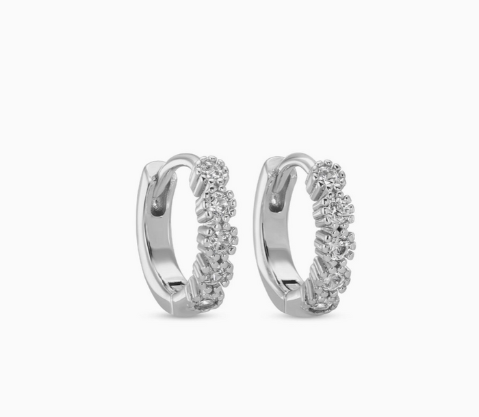 Pair of silver hoop earrings with small diamonds on a white background