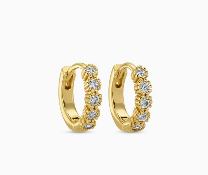Gold hoop earrings with diamond accents on a white background