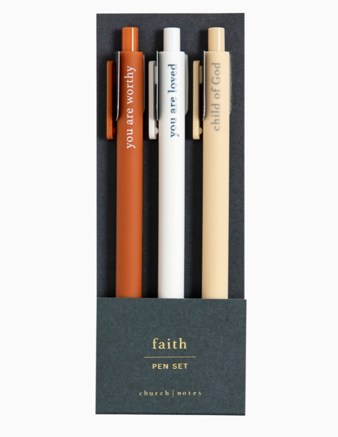 Three pens in a black box with motivational phrases, branded 'faith'.