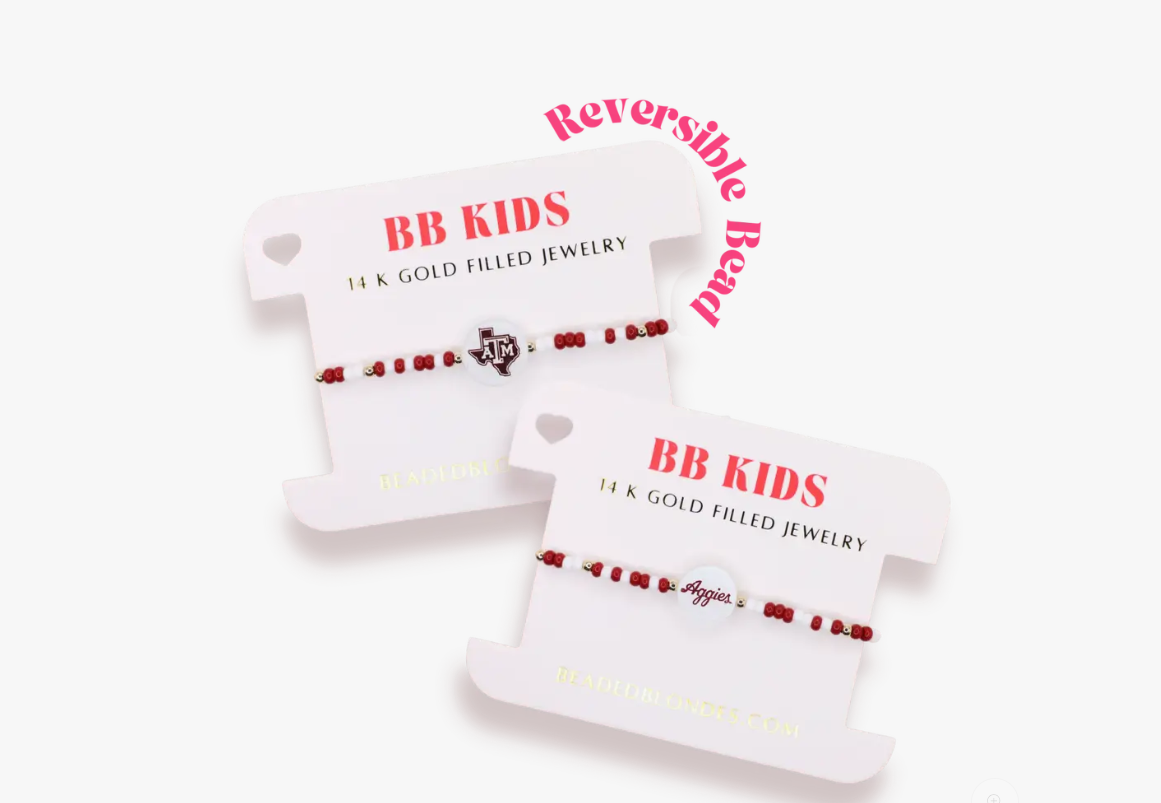 Two white card holders with red text and gold accents on a white background beaded blondes bracelet 