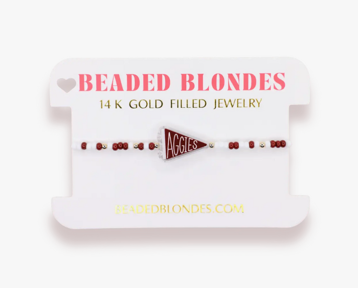 Beaded blondes jewelry with 'Aggies' triangle emblem on a white card.