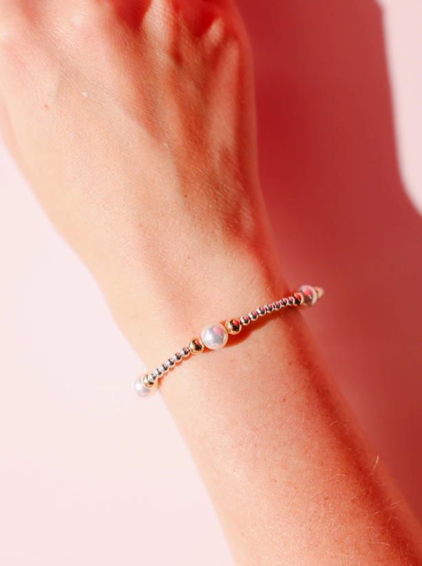 Close-up of a wrist wearing a bracelet with a blurred background beaded blondes serena bracelet 