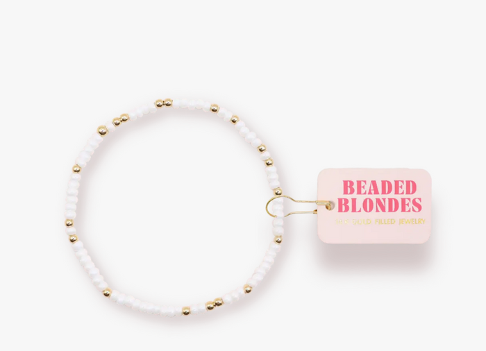 white beaded bracelet for kids with gold accent beads
