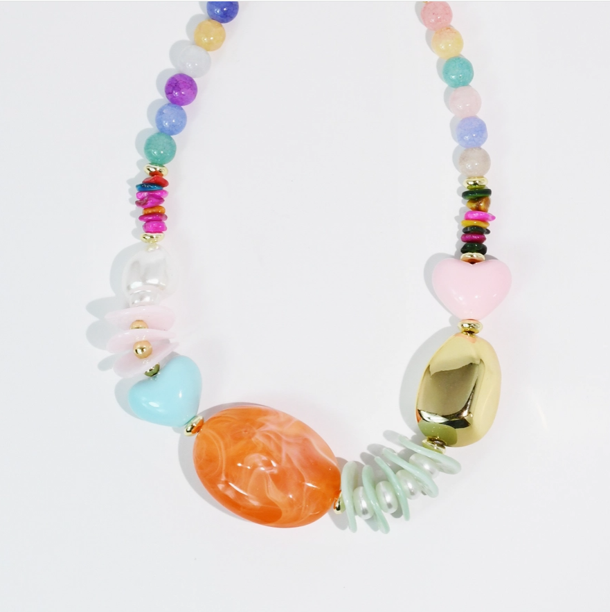 Colorful beaded necklace with various shapes on a white background