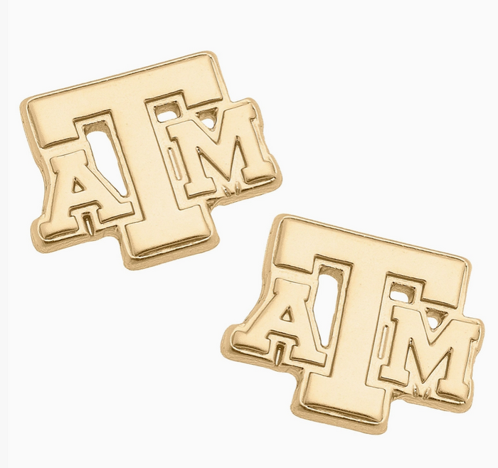 A pair of gold-toned stud earrings shaped like the Texas A&M 'ATM' logo, shown on a clean white background.
