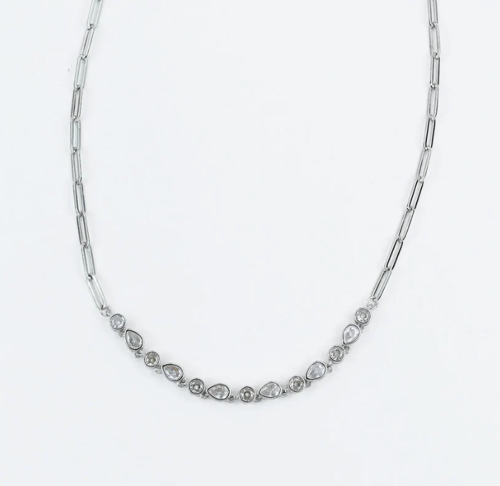 A silver-toned chain necklace featuring a curved row of small marquise and round-cut clear stones at the center, photographed on a plain white background.