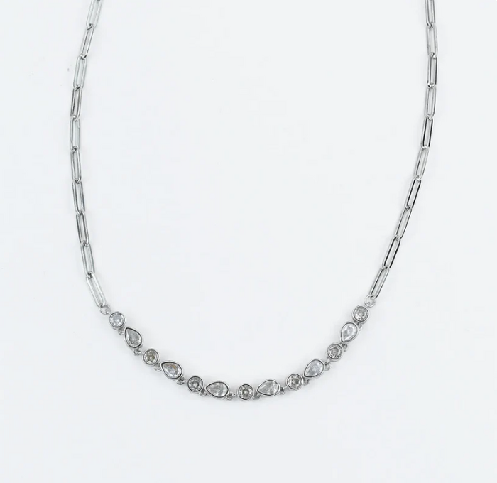 A silver-toned chain necklace featuring a curved row of small marquise and round-cut clear stones at the center, photographed on a plain white background.