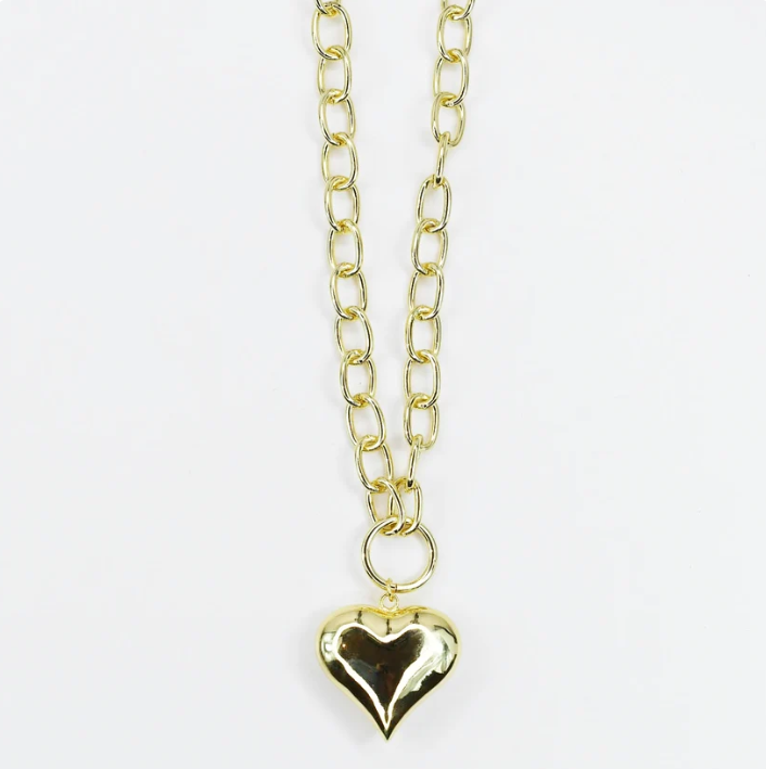 A gold chain necklace with a polished, reflective gold heart-shaped pendant, displayed against a clean white background.