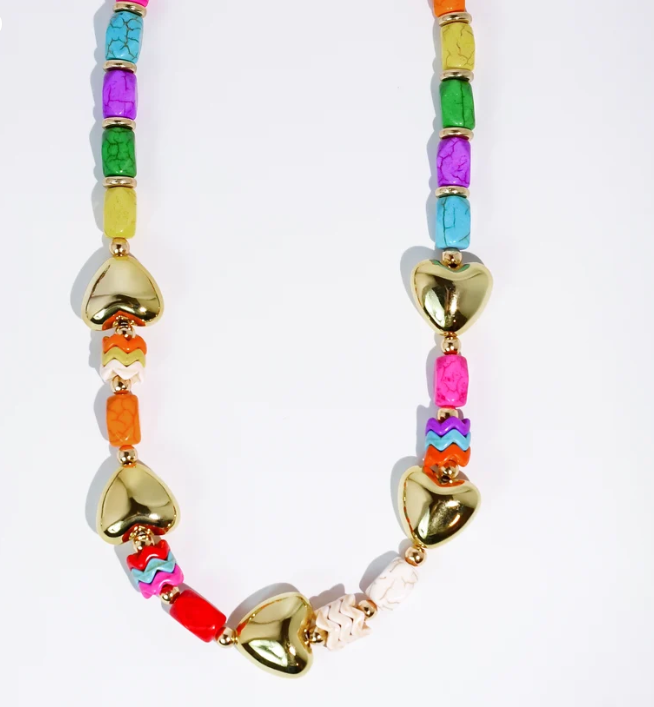 A colorful beaded necklace with shiny gold heart-shaped beads and small cylindrical beads in multiple bright colors, displayed on a clean white background.