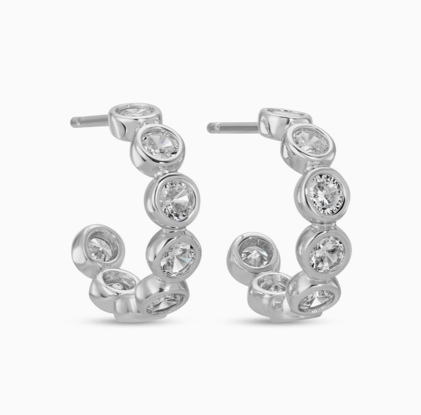 row of sparkling hoop earrings plated silver 
