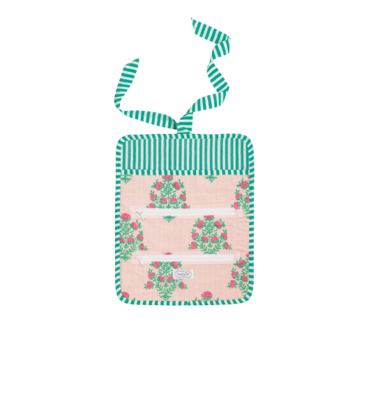Small bag with floral design and green striped handle on a white background