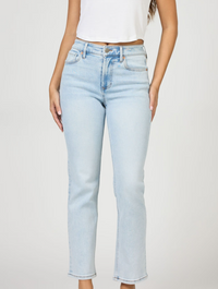 Light blue jeans worn by a person on a plain background