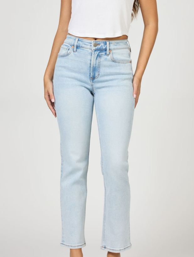 Light blue jeans worn by a person on a plain background