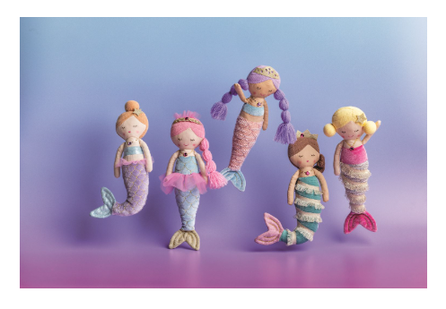 Four handmade mermaid dolls with soft pastel-colored yarn and striped tails, arranged on a purple and blue gradient background.