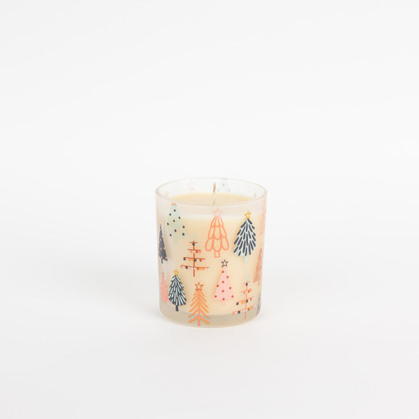 Candle with Christmas tree design on a white background