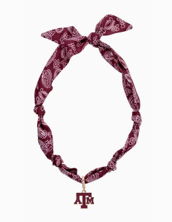 Maroon bandana with white patterns and a Texas A&M logo on a white background