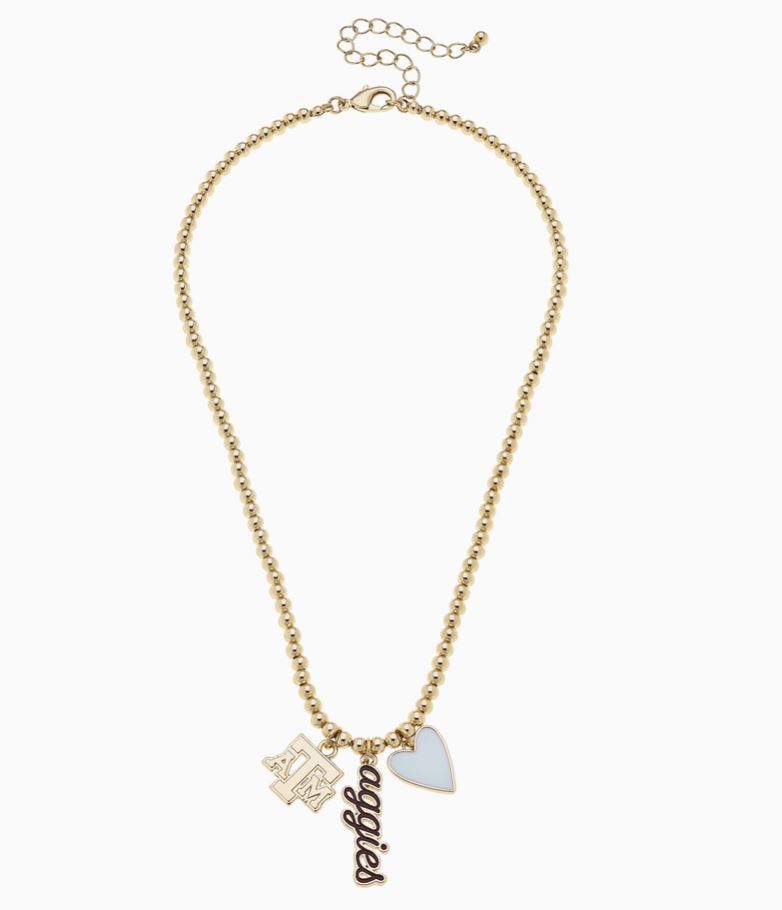 Gold necklace with charms on a white background texas aggies