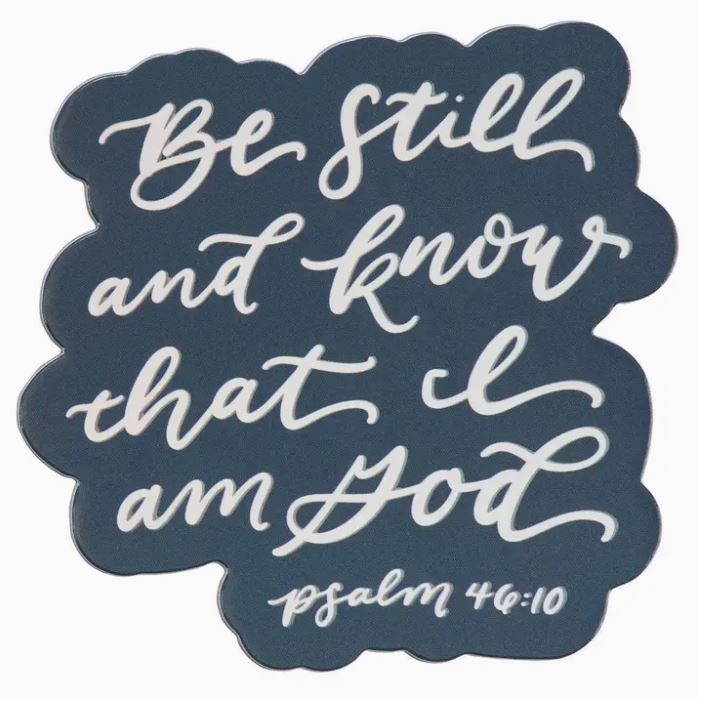Decorative magnet with 'Be still and know that I am God' text on a dark blue background