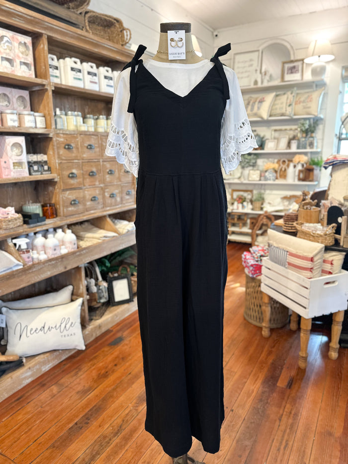 black cotton tie strap jumpsuit with pockets in front