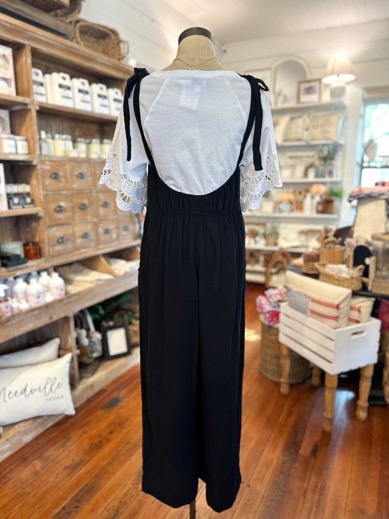black cotton tie strap jumpsuit with pockets in front
