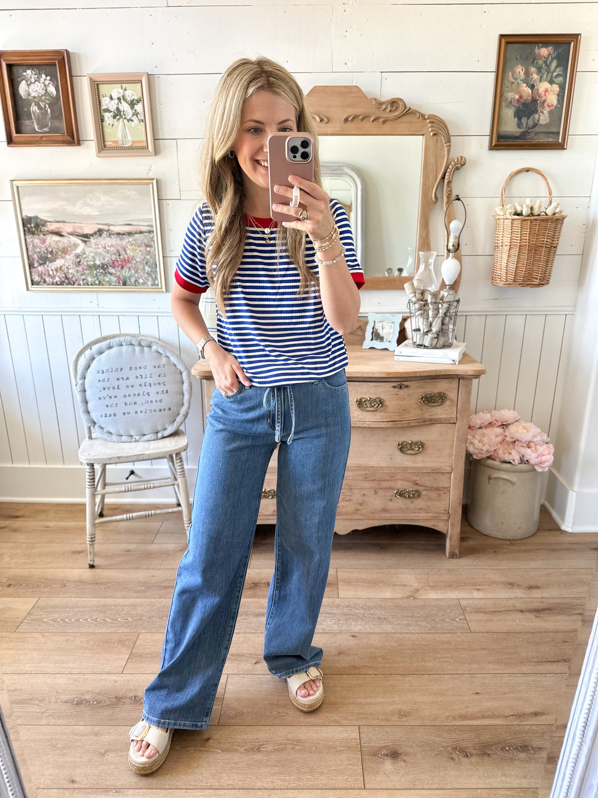blue and white short sleeve top with accent of red staccato