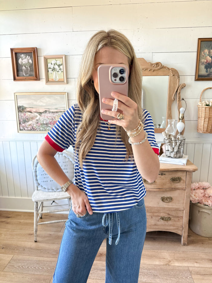blue and white stripe short sleeve top with accent of red 