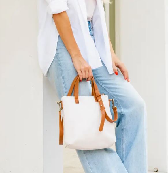 white and tan purse 
