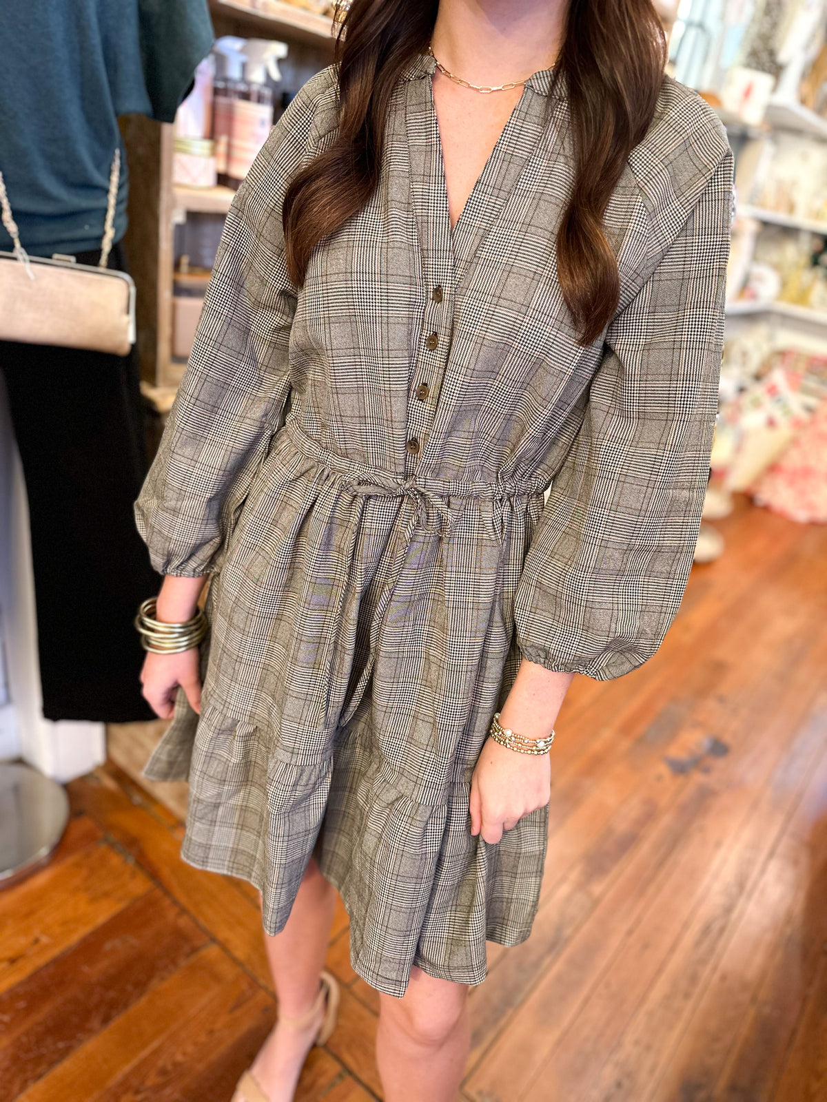 brown and black plaid dress with adjustable waist and slight puff sleeves 