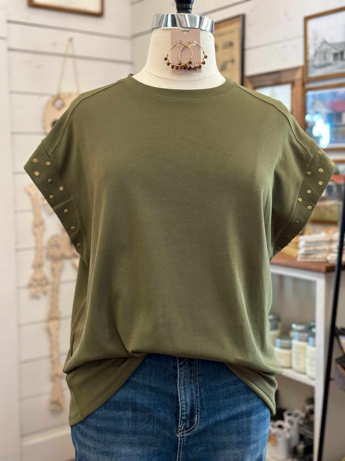 olive green top with bronze accents on sleeves