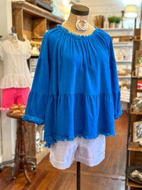 bright blue linen top with flowy sleeves