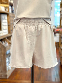 cream color elastic band shorts