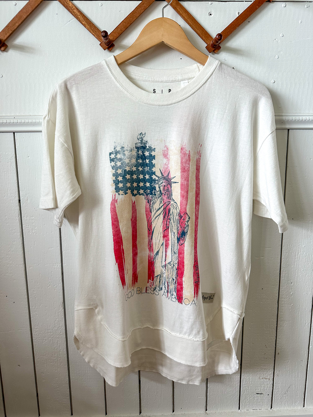 august bleu tee with flag red white blue cruved hem