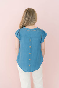 back of chambray cap sleeve top with button accents