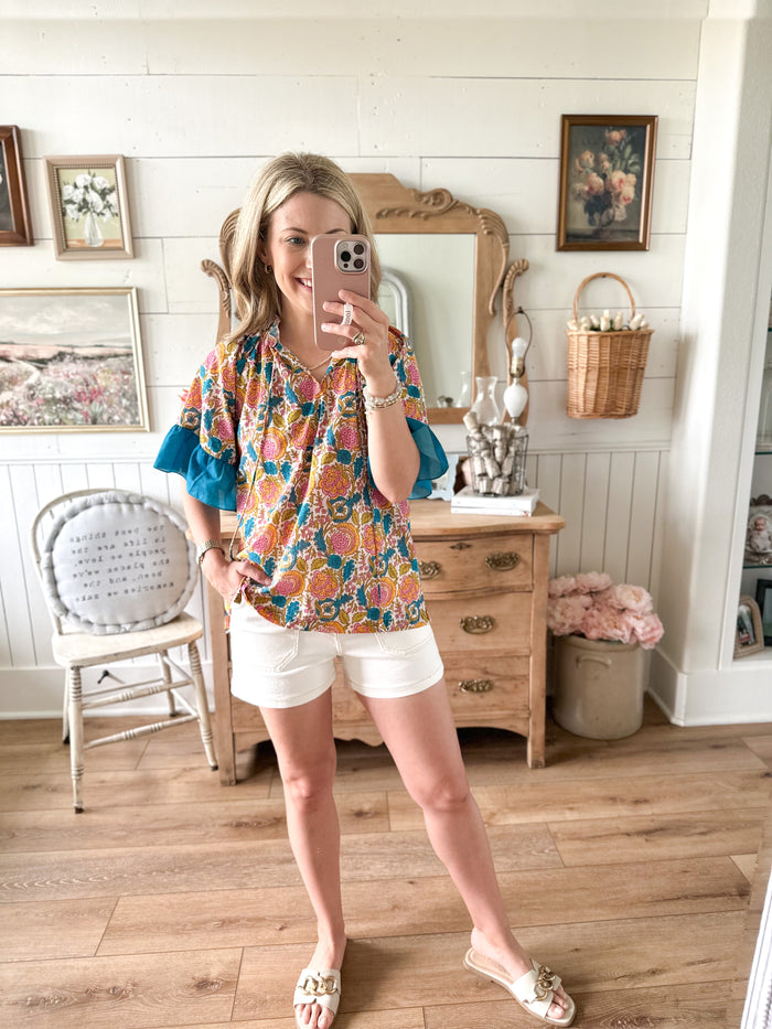 layerz clothing bell top floral print with cream shorts 