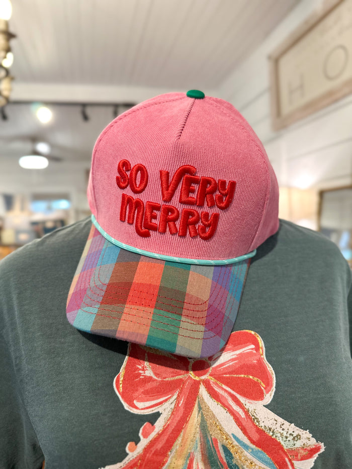 so very merry pink corduroy hat with plaid brim in store setting 