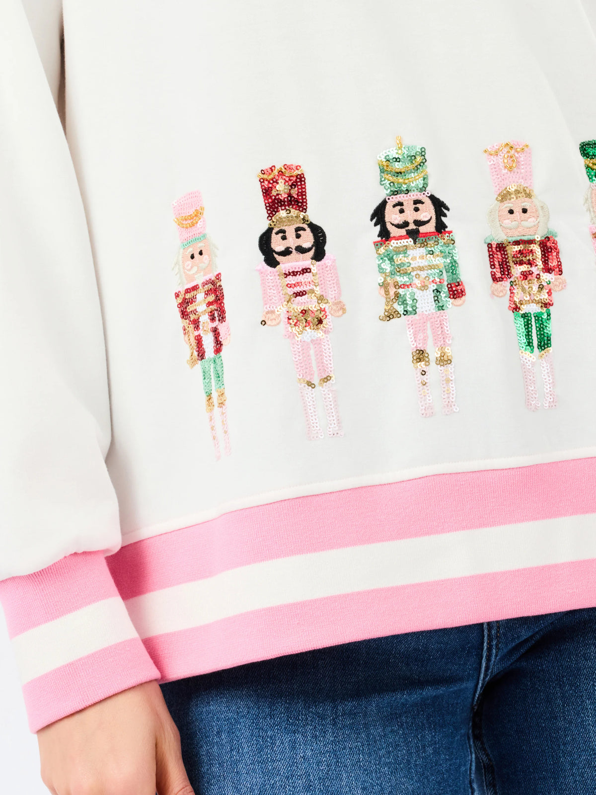 up close sequin nutcracker holiday sweater white with pink 