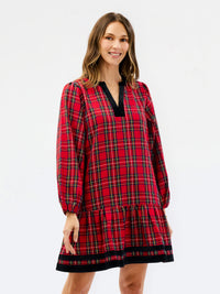traditional red holiday plaid dress with tiered bottom and velvet details on white background 