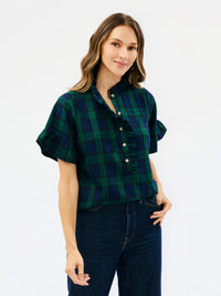 green and blue plaid top with ruffle details holiday look and more on a white background 