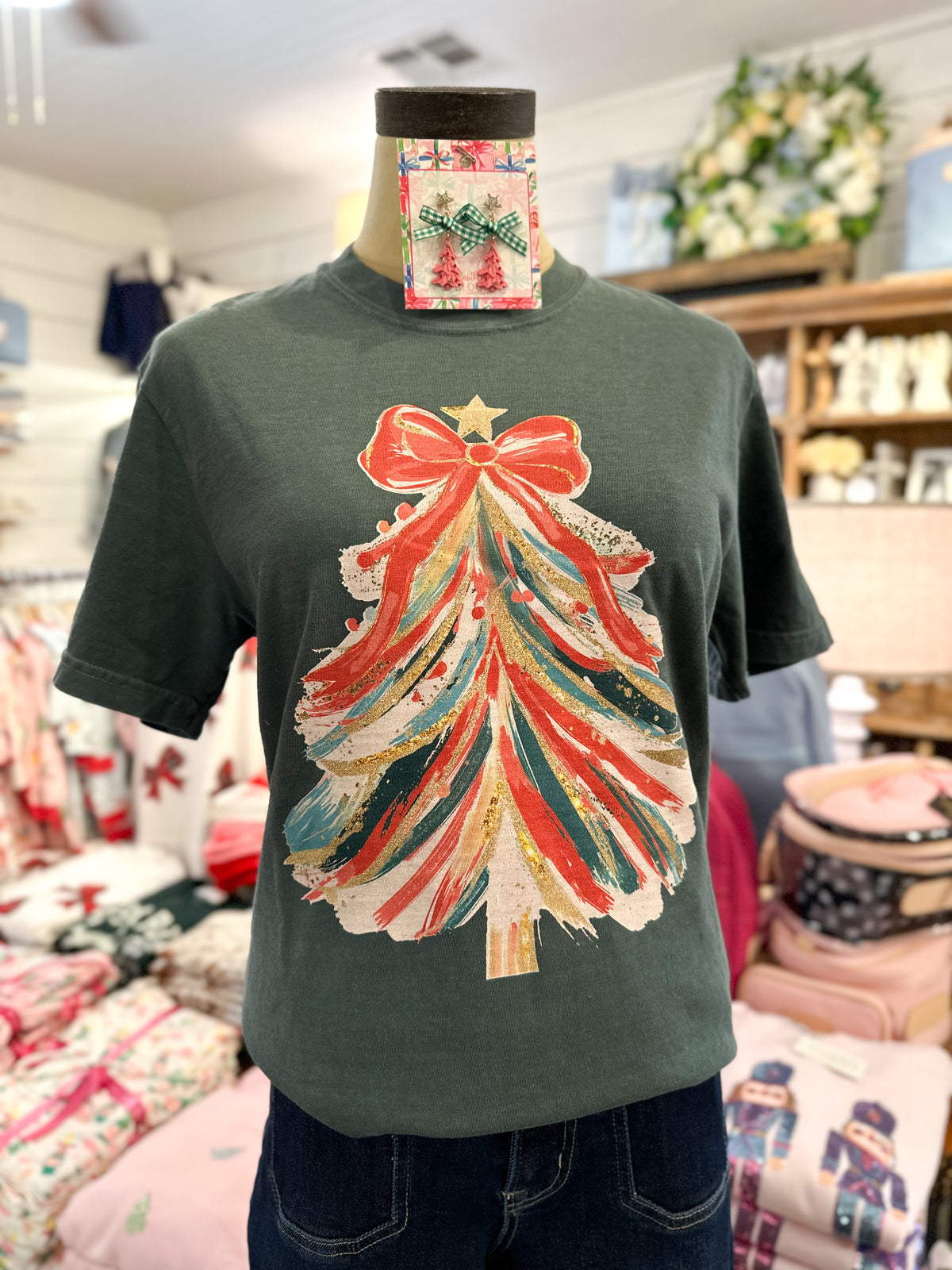 green christmas tree tshirt inside store setting 