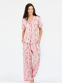 pink women christmas cottage pajama set button down top with white background 