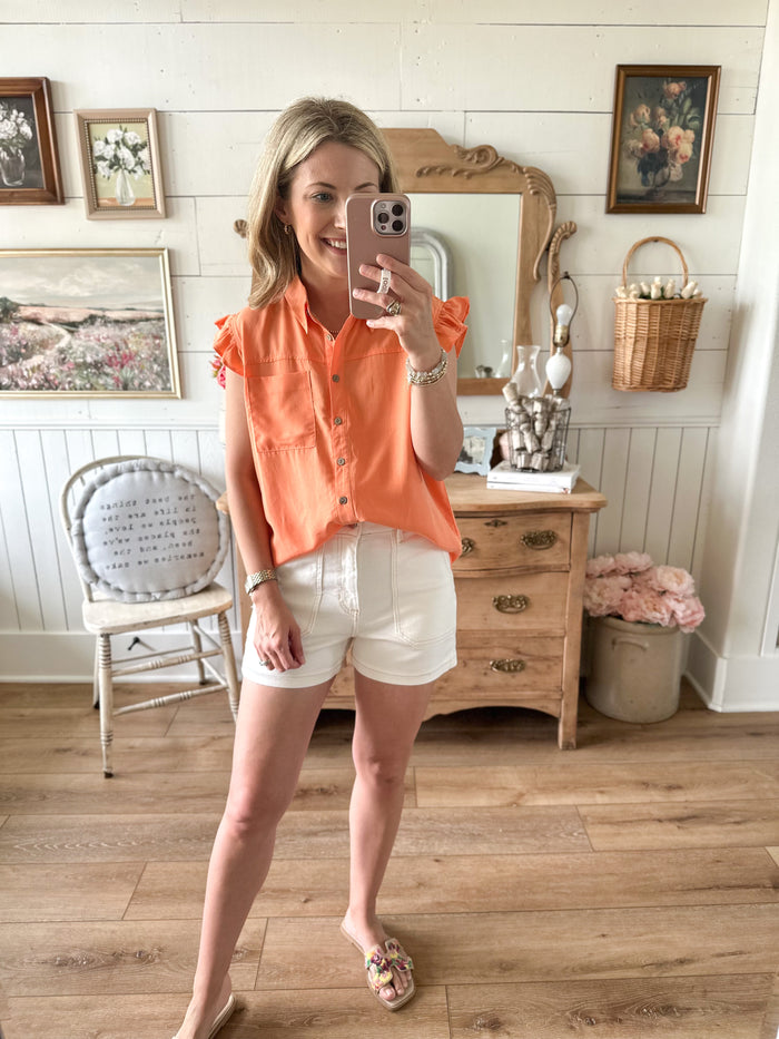 melon color button down top with front pocket and flutter sleeves 